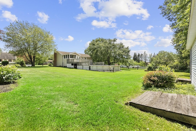 66 Pinnacle Rd, Bristol, CT 06010 - view of grassy yard with a swimming pool and a deck