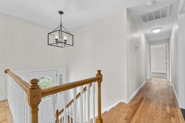 66 Pinnacle Rd, Bristol, CT 06010 - hall with an upstairs landing, a chandelier, and light wood-style floors
