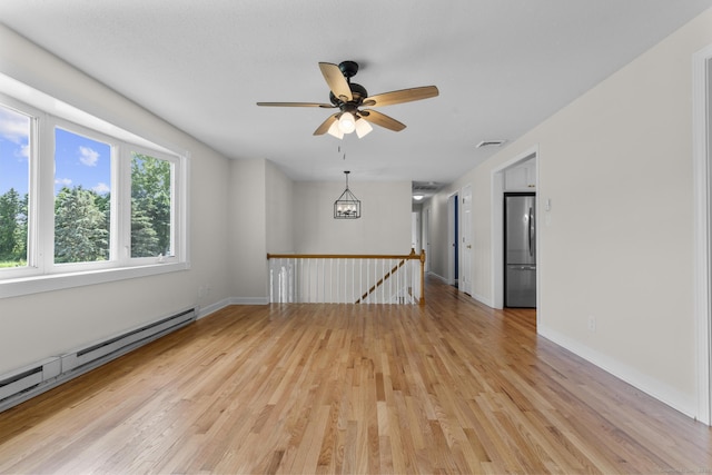 66 Pinnacle Rd, Bristol, CT 06010 - empty room featuring baseboard heating, light wood-style flooring, and ceiling fan