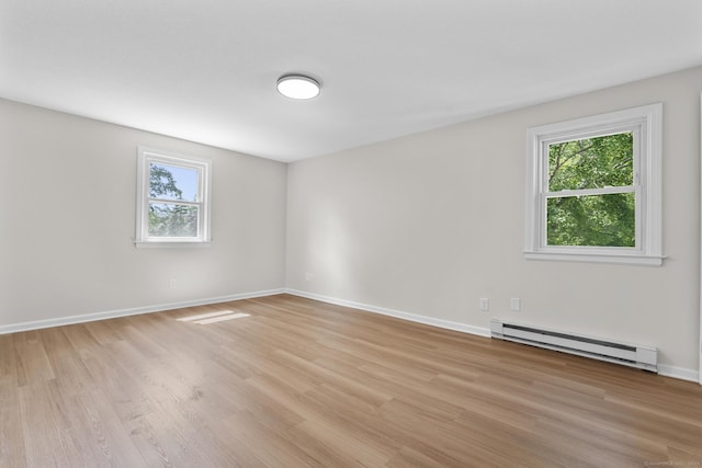 66 Pinnacle Rd, Bristol, CT 06010 - spare room featuring a baseboard heating unit, plenty of natural light, and light wood finished floors