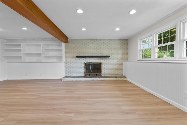 66 Pinnacle Rd, Bristol, CT 06010 - unfurnished living room featuring light wood-style floors, a fireplace, recessed lighting, and beam ceiling