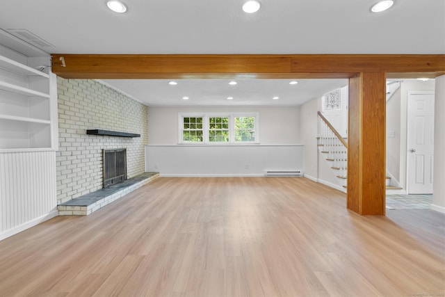 66 Pinnacle Rd, Bristol, CT 06010 - unfurnished living room featuring stairs, baseboard heating, wood finished floors, a fireplace, and recessed lighting