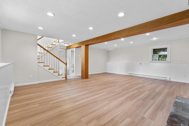 66 Pinnacle Rd, Bristol, CT 06010 - below grade area featuring a baseboard radiator, light wood-style flooring, stairs, recessed lighting, and a wainscoted wall