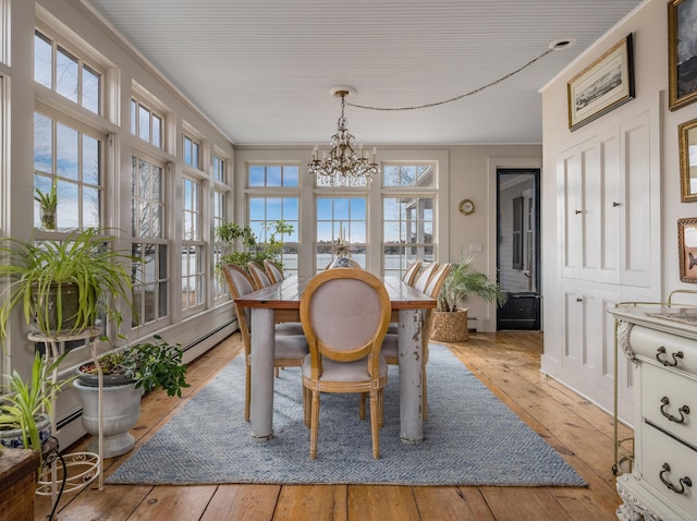 850 Noank Rd, Groton, CT 06355 - dining room featuring a chandelier, hardwood / wood-style floors, crown molding, and a baseboard heating unit