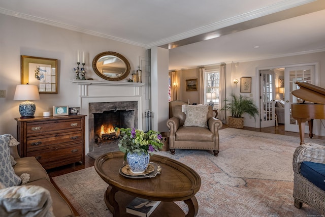 850 Noank Rd, Groton, CT 06355 - living room with ornamental molding, a fireplace, french doors, and wood finished floors