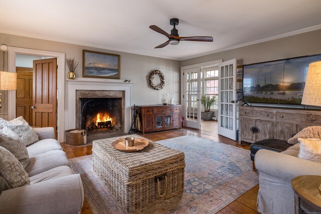 850 Noank Rd, Groton, CT 06355 - living area featuring ornamental molding, ceiling fan, a premium fireplace, and wood finished floors