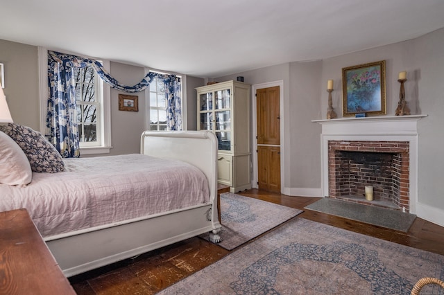 850 Noank Rd, Groton, CT 06355 - bedroom featuring wood finished floors and a brick fireplace