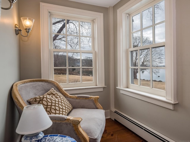 850 Noank Rd, Groton, CT 06355 - living area with a baseboard heating unit and dark wood-style floors