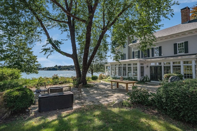 850 Noank Rd, Groton, CT 06355 - view of yard with a patio area, an outdoor fire pit, a sunroom, and a water view