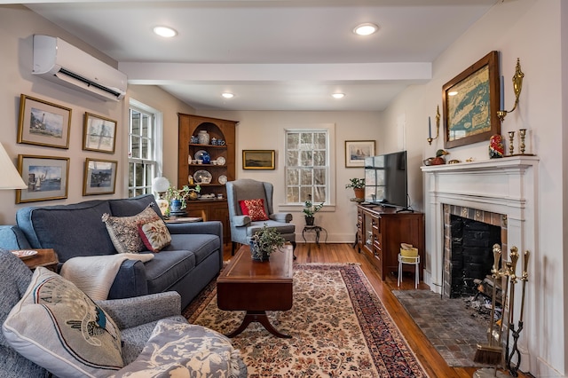 850 Noank Rd, Groton, CT 06355 - living area featuring an AC wall unit, wood finished floors, a fireplace, plenty of natural light, and recessed lighting