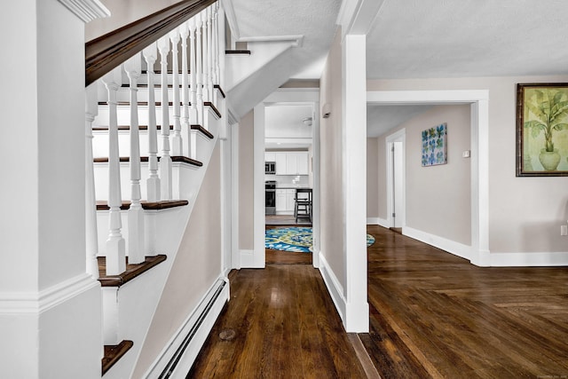 300 Central Ave, Norwich, CT 06360 - corridor featuring a baseboard heating unit and parquet floors