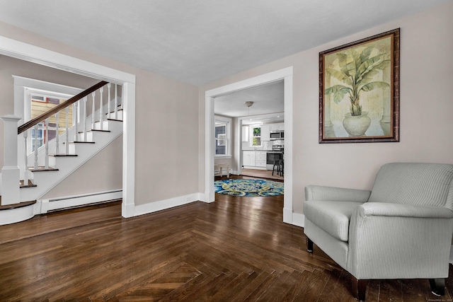300 Central Ave, Norwich, CT 06360 - living area featuring stairway and a baseboard heating unit