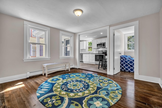 300 Central Ave, Norwich, CT 06360 - sitting room with baseboard heating and dark wood-style floors