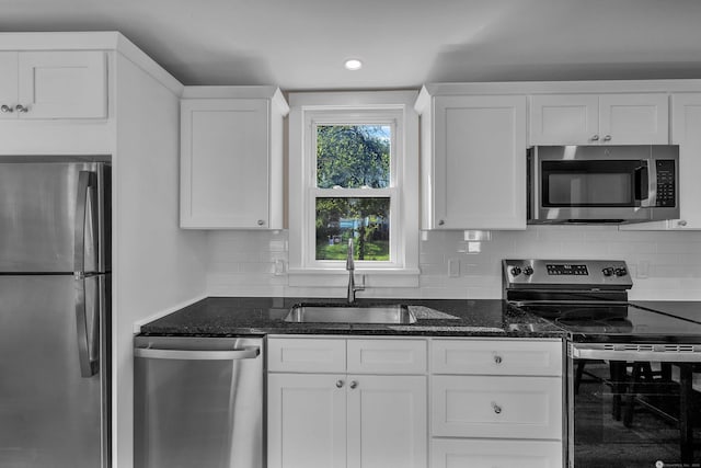 300 Central Ave, Norwich, CT 06360 - kitchen with appliances with stainless steel finishes, white cabinets, dark stone counters, and recessed lighting