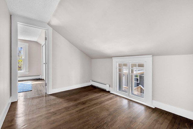 300 Central Ave, Norwich, CT 06360 - bonus room with a baseboard heating unit, lofted ceiling, and dark wood-style flooring