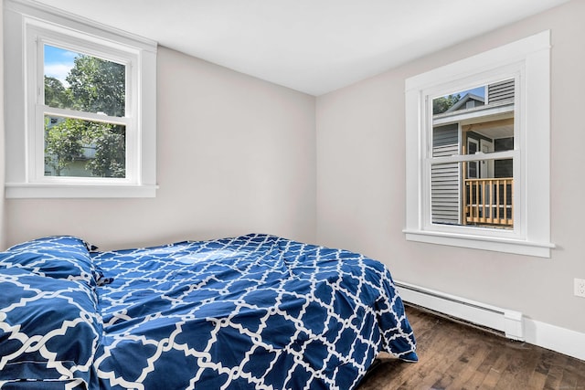 300 Central Ave, Norwich, CT 06360 - bedroom with a baseboard heating unit and wood finished floors