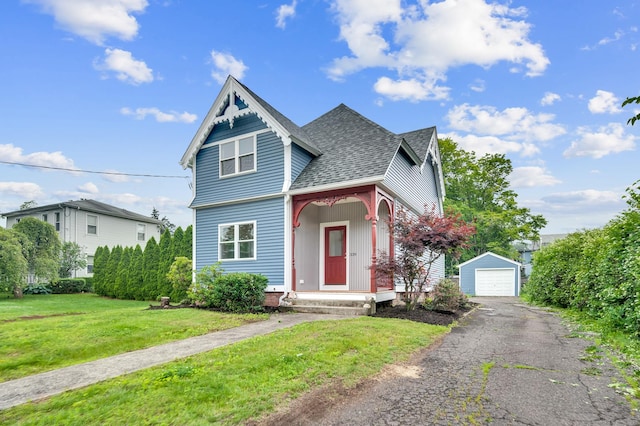 339 Main St, Wallingford, CT 06492 - victorian-style house with an outbuilding, a detached garage, a shingled roof, driveway, and a front lawn