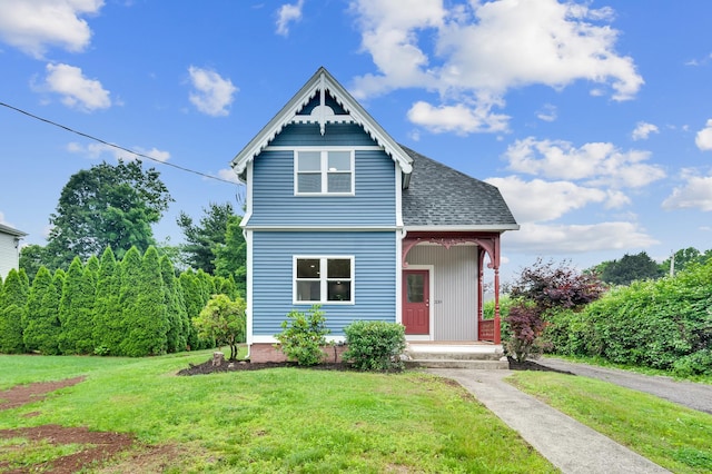 339 Main St, Wallingford, CT 06492 - victorian-style house featuring a front yard, a shingled roof, and a porch