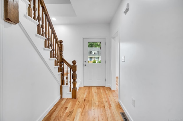 339 Main St, Wallingford, CT 06492 - doorway to outside with light wood finished floors, stairway, and recessed lighting