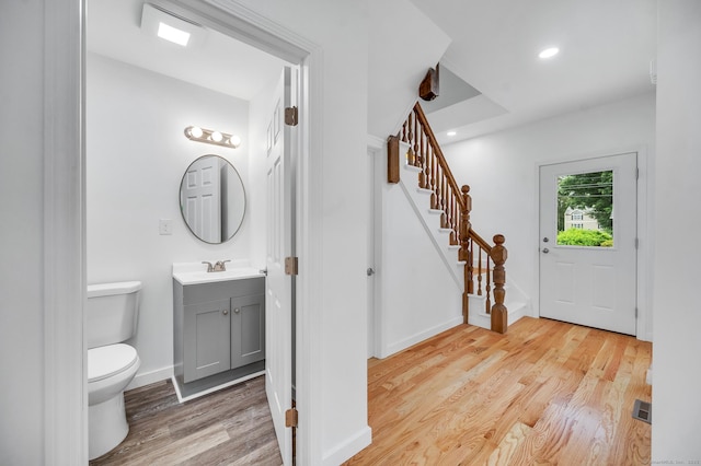 339 Main St, Wallingford, CT 06492 - bathroom with wood finished floors, vanity, and recessed lighting