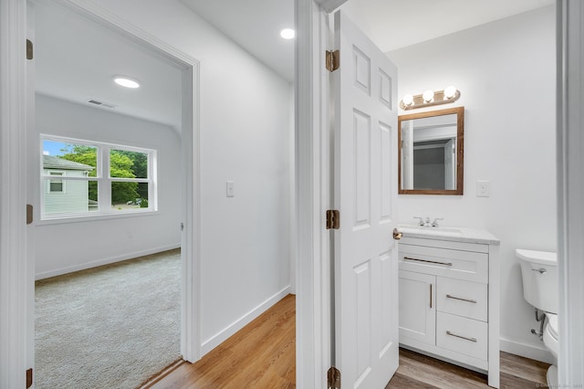 339 Main St, Wallingford, CT 06492 - bathroom featuring vanity and wood finished floors