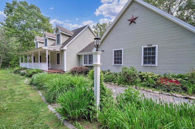 42 Woodmont Cir, East Haddam, CT 06423 - view of property exterior with a porch and a yard