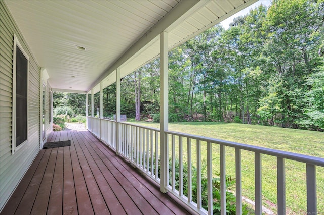 42 Woodmont Cir, East Haddam, CT 06423 - wooden porch featuring a lawn and view of scattered trees