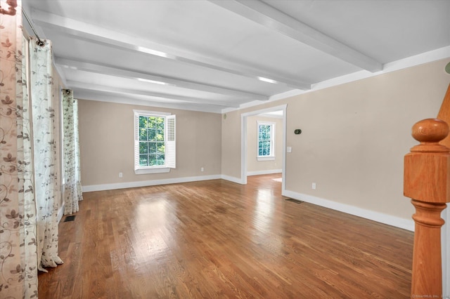 42 Woodmont Cir, East Haddam, CT 06423 - empty room with beamed ceiling, healthy amount of natural light, and wood finished floors