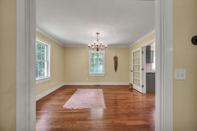 42 Woodmont Cir, East Haddam, CT 06423 - empty room with a chandelier, wood finished floors, and crown molding