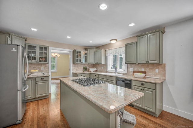 42 Woodmont Cir, East Haddam, CT 06423 - kitchen featuring appliances with stainless steel finishes, a kitchen island, plenty of natural light, tasteful backsplash, and recessed lighting