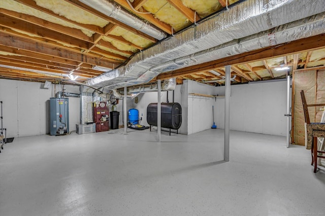 42 Woodmont Cir, East Haddam, CT 06423 - unfinished below grade area with heating fuel, water heater, and a water pressure tank