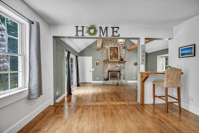 42 Woodmont Cir, East Haddam, CT 06423 - living room featuring wood finished floors, plenty of natural light, lofted ceiling, and a fireplace