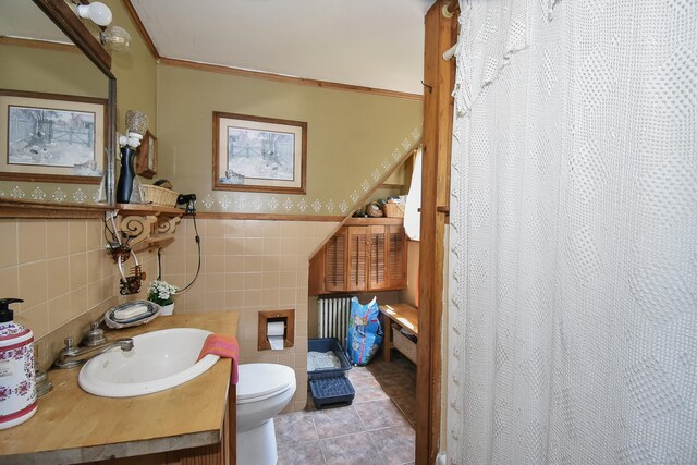 279 Pratt St, Winchester, CT 06098 - full bath with tile walls, wainscoting, vanity, a shower with shower curtain, and tile patterned floors