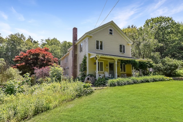 279 Pratt St, Winchester, CT 06098 - view of front of house featuring a chimney, covered porch, and a front yard