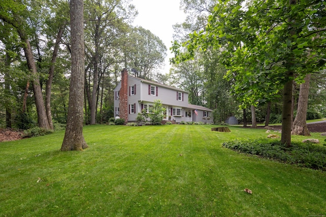 1 Whippoorwill Ln, Brookfield, CT 06804 - view of front of property featuring a chimney and a front yard
