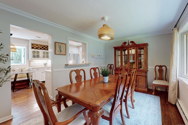 1 Whippoorwill Ln, Brookfield, CT 06804 - dining room featuring a baseboard radiator, light wood-type flooring, and ornamental molding