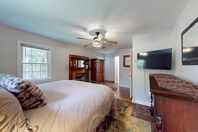 1 Whippoorwill Ln, Brookfield, CT 06804 - bedroom featuring wood finished floors, ceiling fan, and a fireplace