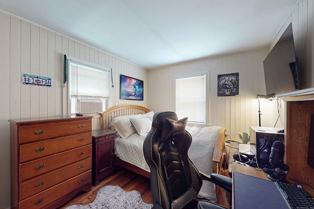 1 Whippoorwill Ln, Brookfield, CT 06804 - bedroom with dark wood-style flooring, cooling unit, multiple windows, and wooden walls