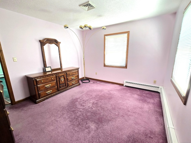 51 Peppermint Ln, Bristol, CT 06010 - unfurnished bedroom with baseboard heating, carpet, and a textured ceiling