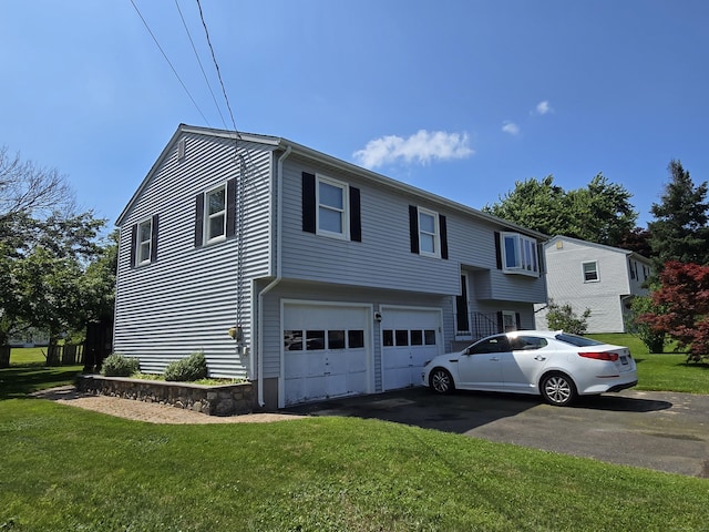 51 Peppermint Ln, Bristol, CT 06010 - split foyer home featuring driveway, a garage, and a front yard