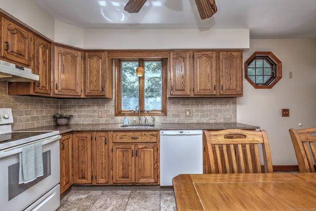 55 Mary Ellen Dr, Milford, CT 06460 - kitchen featuring white appliances, under cabinet range hood, brown cabinets, and tasteful backsplash