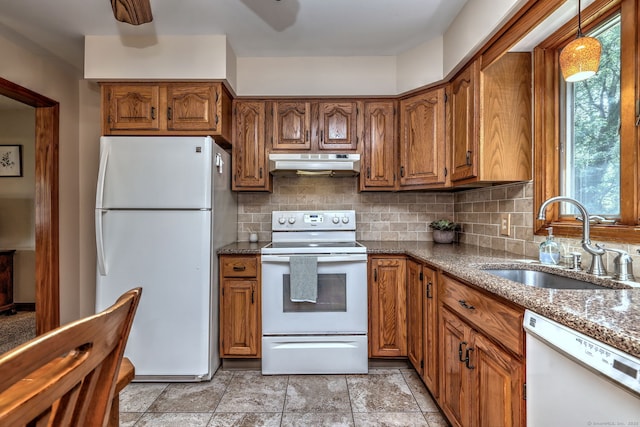 55 Mary Ellen Dr, Milford, CT 06460 - kitchen featuring white appliances, under cabinet range hood, brown cabinetry, and backsplash
