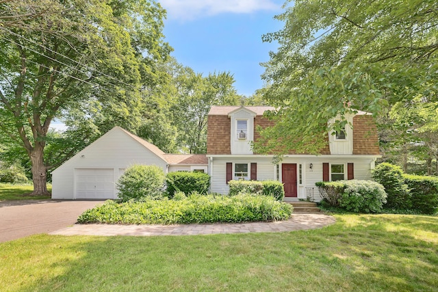 108 Pilgrim Dr, Windsor, CT 06095 - dutch colonial featuring a front lawn, a garage, driveway, and a shingled roof