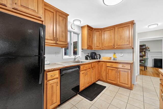 108 Pilgrim Dr, Windsor, CT 06095 - kitchen with black appliances, light countertops, light tile patterned floors, and brown cabinetry