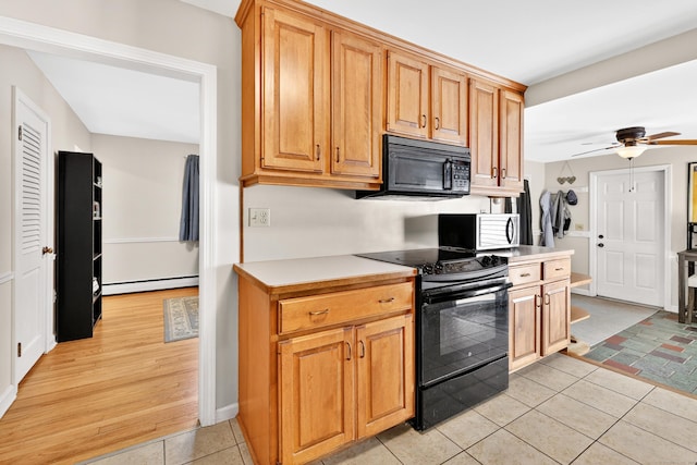 108 Pilgrim Dr, Windsor, CT 06095 - kitchen featuring black appliances, a baseboard radiator, a ceiling fan, light tile patterned floors, and light countertops