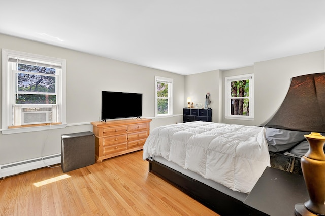 108 Pilgrim Dr, Windsor, CT 06095 - bedroom featuring a baseboard radiator and light wood-style flooring