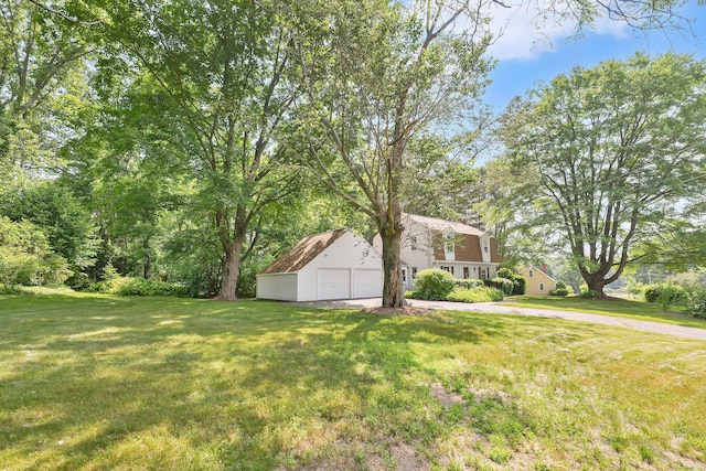 108 Pilgrim Dr, Windsor, CT 06095 - view of green lawn with a detached garage