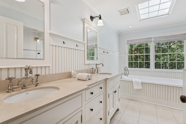 47 Tubbs Spring Dr, Weston, CT 06883 - full bathroom with tile patterned flooring, a garden tub, double vanity, wainscoting, and ornamental molding