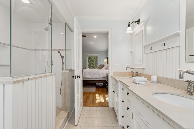 47 Tubbs Spring Dr, Weston, CT 06883 - bathroom featuring double vanity, a tile shower, ensuite bathroom, tile patterned floors, and ornamental molding
