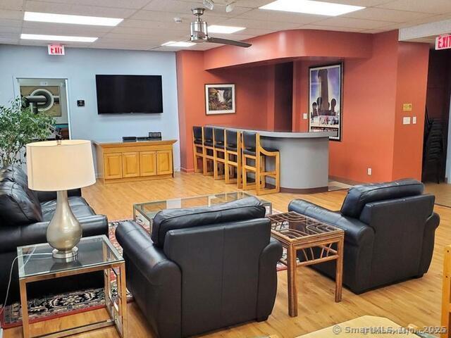 31 Woodland St Unit 7F, Hartford, CT 06103 - living area featuring a drop ceiling and light wood finished floors